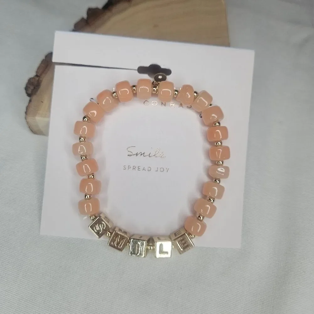 Lauren Conrad Gold Tone Metal And Peach Glass Bead Stretch Smile Bracelet